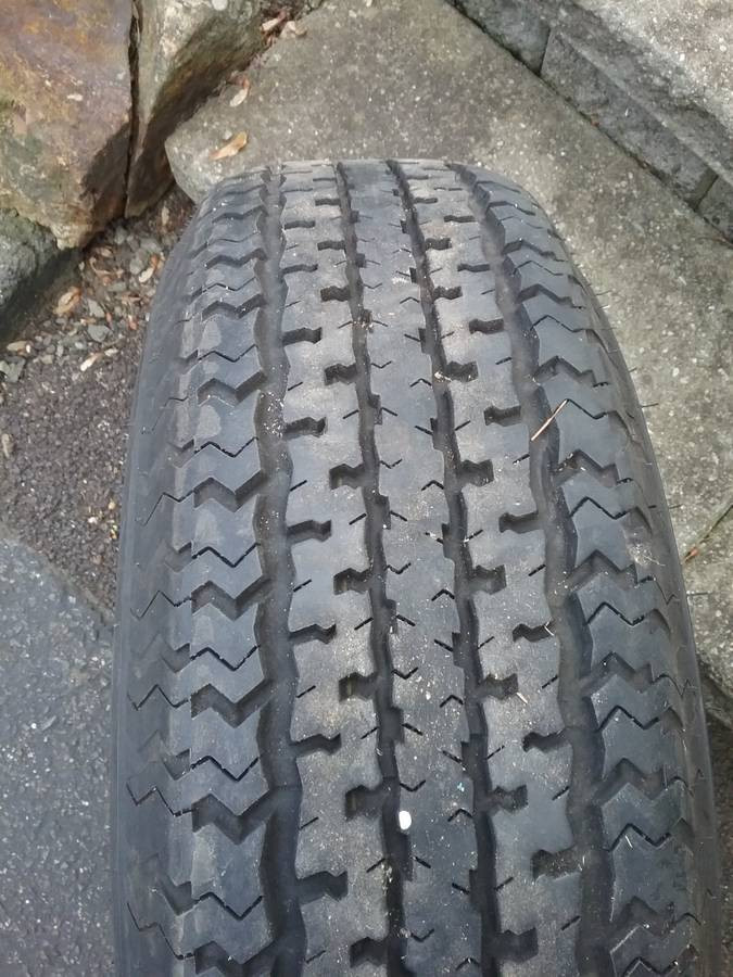 trailer tire + rim - $75 (DANBURY)-pic_1